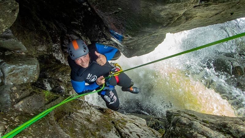 Awesome_fun_a_person_abseiling_down_the_funnel_in_Longsleddale_canyon