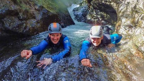 Two super excited ghyll scramblers in the deep dip pool at Stoneycroft Ghyll near Keswick.